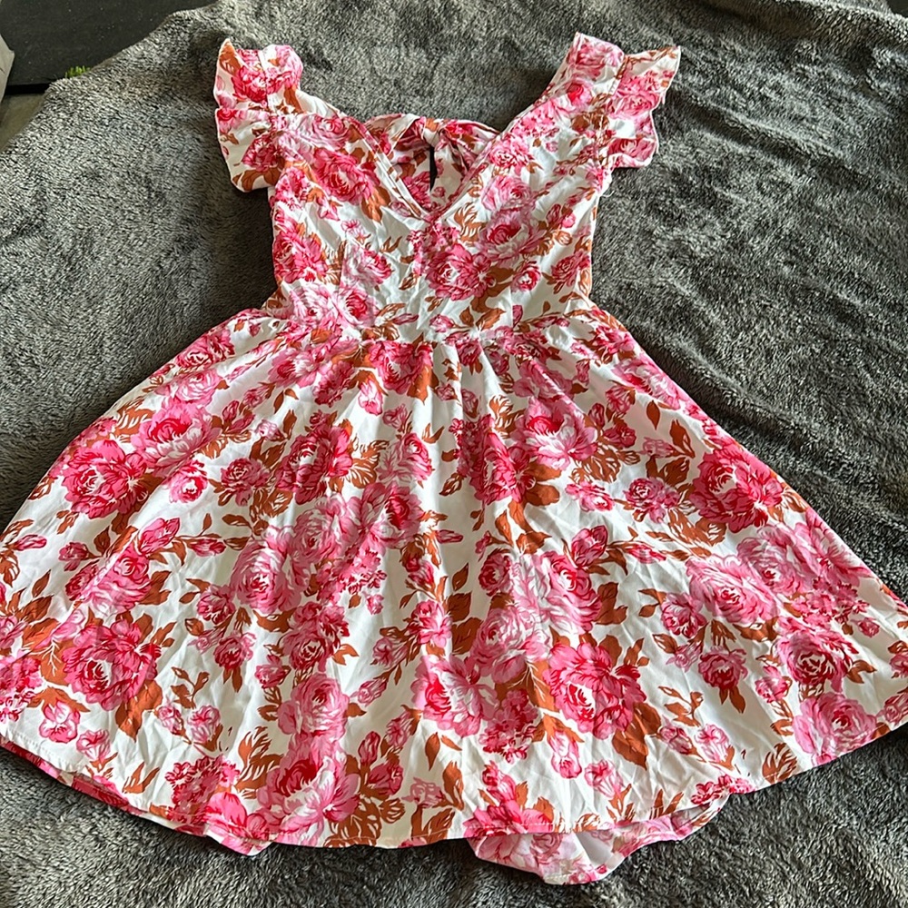 NWT dress with tie back closure and open back. Size L